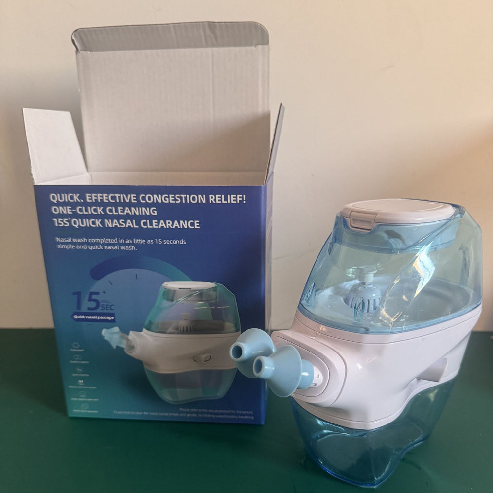 STILLWELL electric nasal irrigator unboxed next to its retail packaging