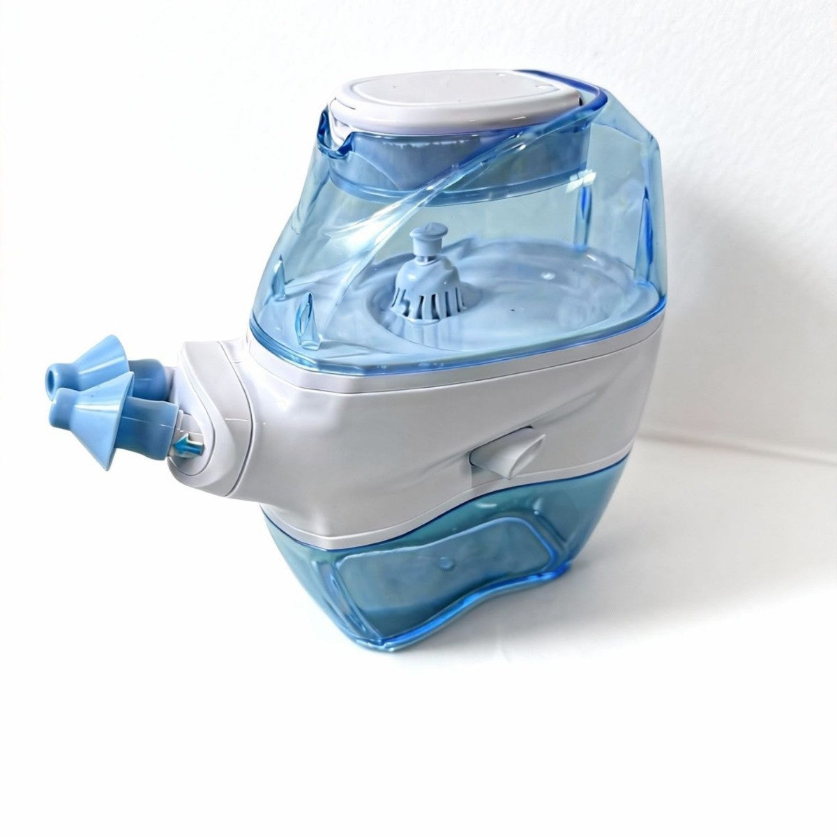 Angled studio photo of the STILLWELL electric nasal irrigator